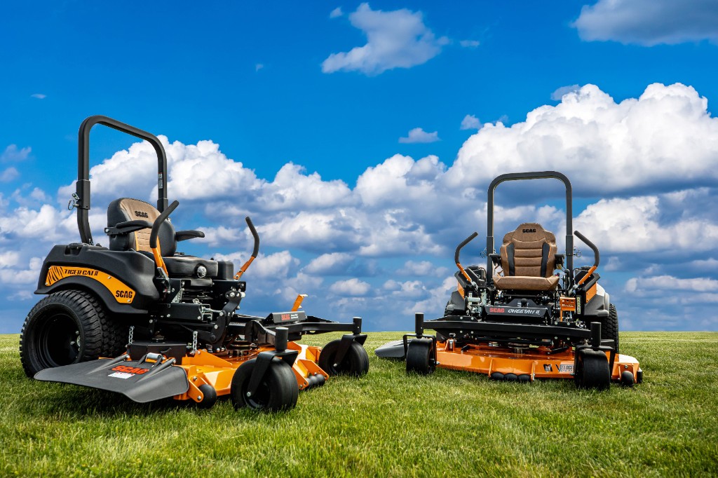 Lawn mower cutting green grass